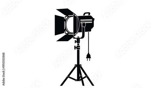 Professional studio spotlight equipment mounted on a tripod stand for film and video production