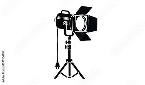 Professional studio spotlight with adjustable barn doors mounted on a sturdy metal tripod stand