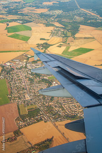 Airplane Wing Over Paris Outskirts During Descent to Orly Airport