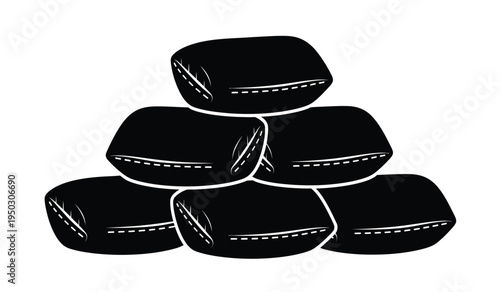 A stack of black sandbag units arranged in a pyramid formation for flood defense and protection