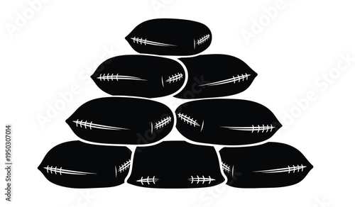 A stacked pyramid of heavy sandbags used for flood protection and temporary defensive barricades