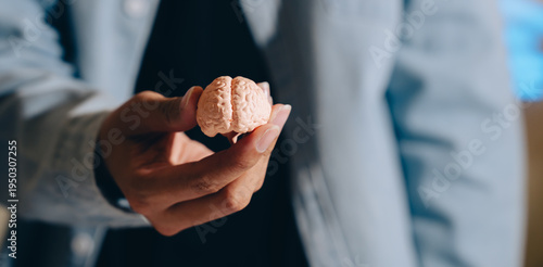 Miniature brain model hand holding brain human brain replica cognitive concept mental health neuroscience education tool close up person with brain thinking symbol medical model anatomy psychology