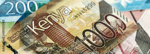 Fotografie Kenyan shilling paper banknotes pile on table
