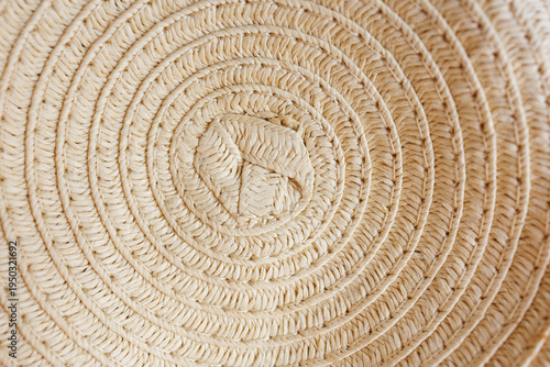 Round woven straw hat texture close up natural summer background