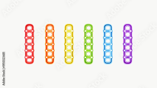 A row of colorful interlocking building blocks displayed on a white background