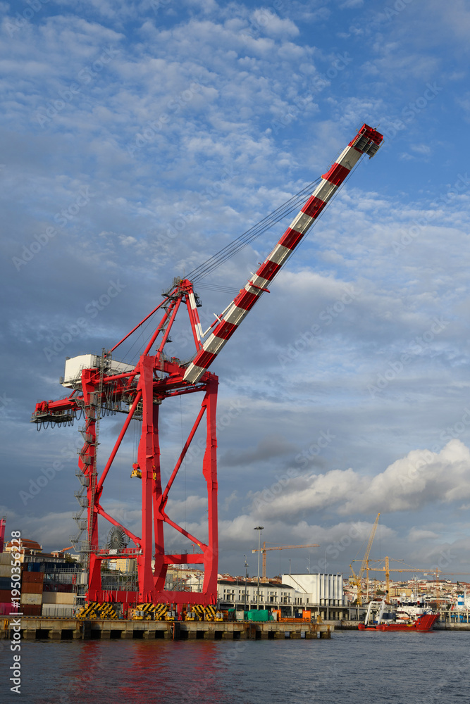 Fototapeta premium A large, ship-to-shore (STS) or quay crane in the Port of Lisbon, Portugal., used to load and unload shipping containers.
