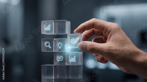 Upskilling and reskilling - A close-up of a hand assembling floating modular skill blocks into a structured stack with a subtle glow, symbolizing growth and teamwork.