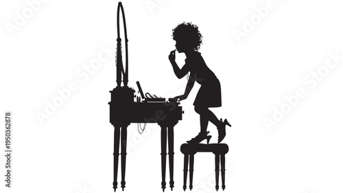Silhouette of a young woman with curly hair applying lipstick while standing on a stool next to a vanity table.