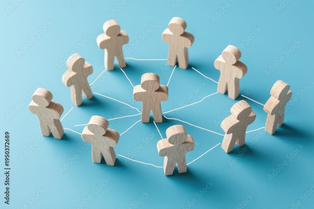 Obraz premium Unity and Connection: Wooden figures symbolize a connected network, emphasizing collaboration and the strength found in togetherness.