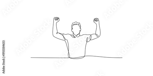A man sitting with his fists raised in the air in a celebratory gesture person