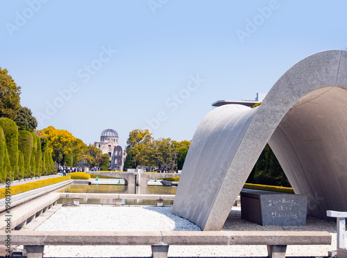 Photos Cenotaph at Hiroshima peace park Atomic bomb dome in the background - Hiroshima,