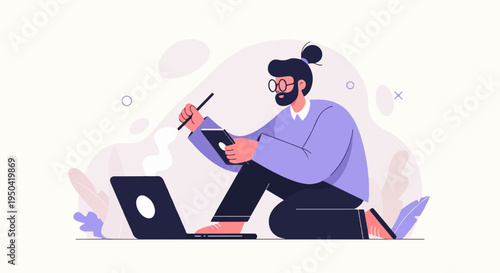 Person working on laptop and tablet with stylus