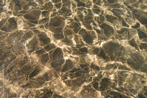 Sunlight water caustics pattern in clear Lake Michigan water