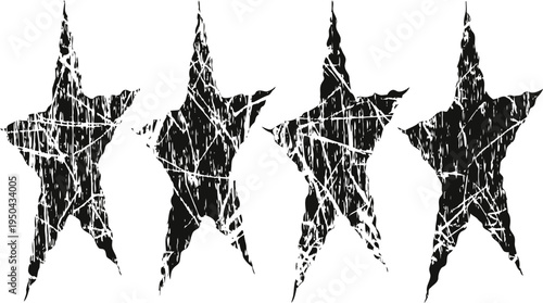 Four grunge black stars with distressed texture and rough edges on white background