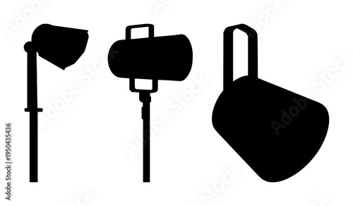 Spotlight set with solid black silhouette on white background featuring film noir, theatrical lighting, stage illumination with dramatic and monochrome