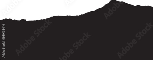 Silhouette of a mountain range with a dark foreground