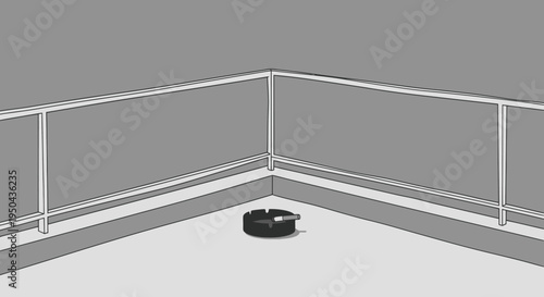 Black circular object on a light-colored floor, a small ashtray.