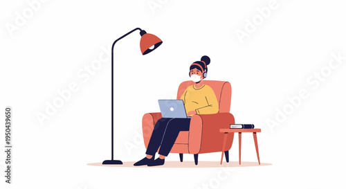 Woman in armchair wearing headphones and mask works on laptop beside floor lamp