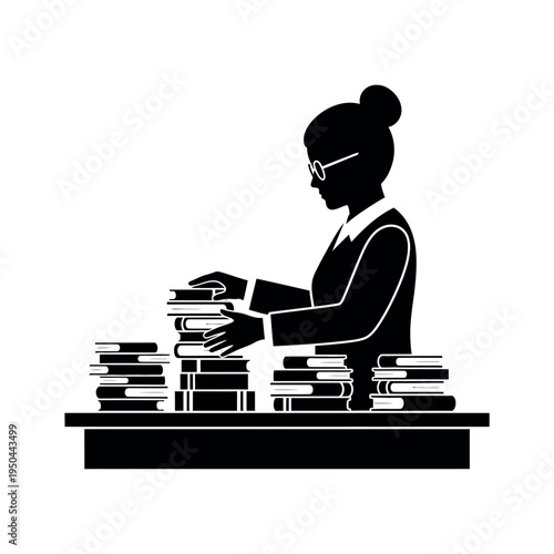 Librarian organizing books on a desk.