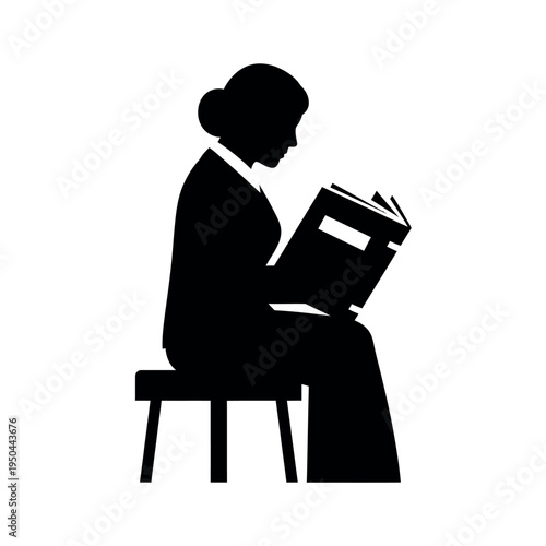 Silhouette of woman reading a book while sitting on a stool.