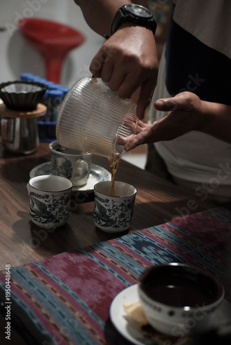 pour filter coffee into a glass, arabica coffee