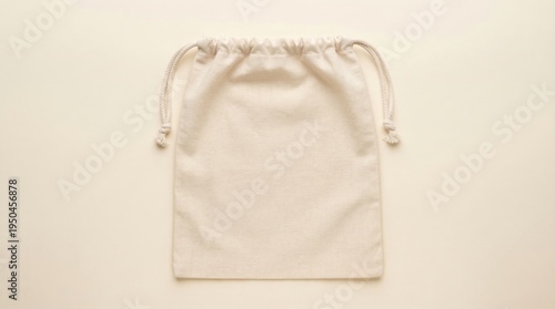 White Drawstring Pouch on Plain Background.