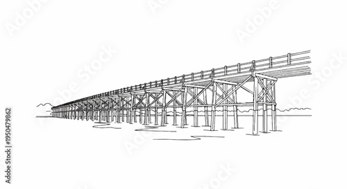 Extensive wooden trestle bridge stretching across a body of water with distant hills