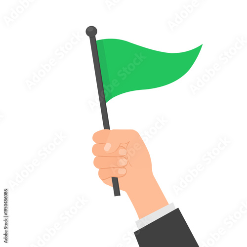 hand holding a triangular green flag. Approval or good sign concept