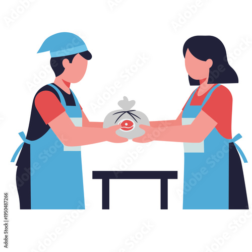 Two people in aprons exchanging a wrapped food item on a table indoors