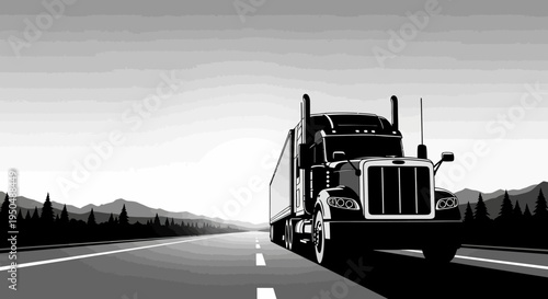 Black and white semi truck driving on highway towards mountains