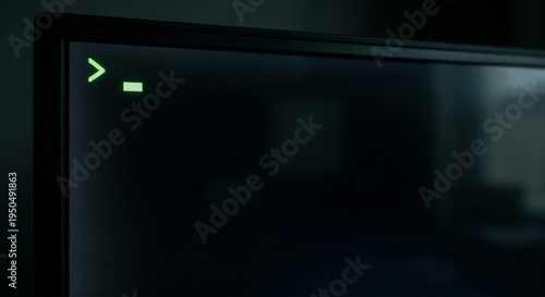 Photos Glowing Green Cursor Blinking on a Dark Computer Monitor Screen
