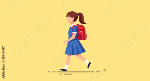 Young schoolgirl in blue uniform walking with red backpack on yellow background