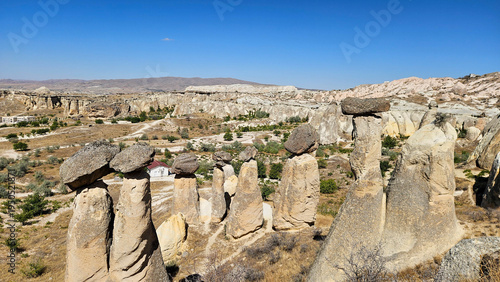 Obraz na płótnie Dense Fairy Chimney Valley Under Clear Sky, Hundreds Of Basalt Capped Pillars Cl