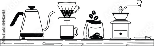 coffee maker, kettle and cup on a table