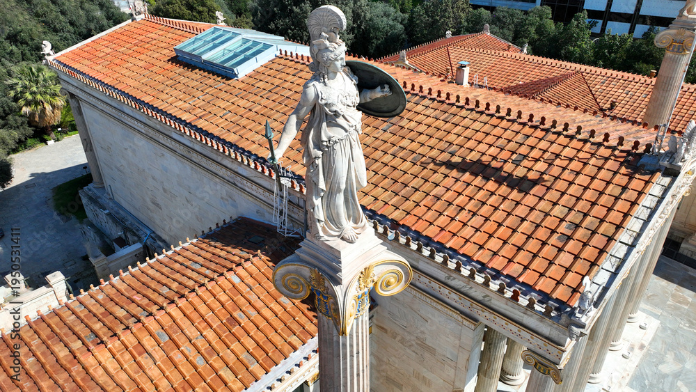 Fototapeta premium Aerial drone photo of historic Neoclassic building of Academy of Athens featuring statue of goddess Athena in Acadimias street, Attica, Greece