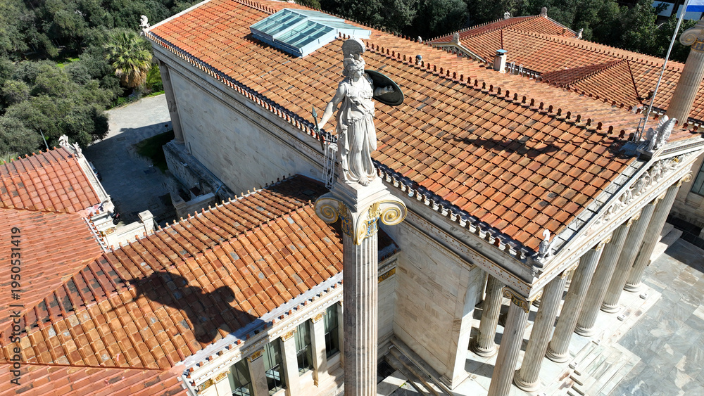 Fototapeta premium Aerial drone photo of historic Neoclassic building of Academy of Athens featuring statue of goddess Athena in Acadimias street, Attica, Greece