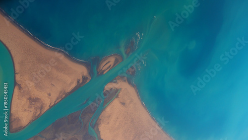 Aerial view from the plane to the desert coastline and ocean