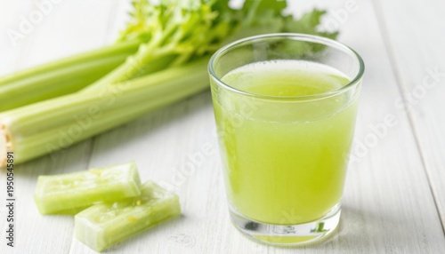 Wallpaper Mural Juicing fresh celery for health benefits kitchen food photography bright natural lighting nutrition concept Torontodigital.ca