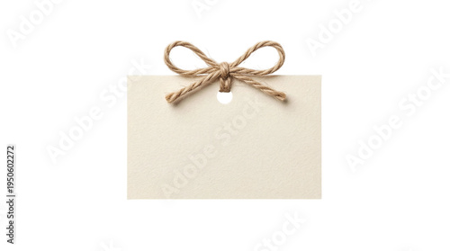 Fotografie Blank beige craft paper tag with rustic jute twine bow on a transparent backgrou