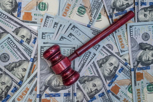 Judicial Gavel on US Dollars Background for Business Arbitration and Financial Dispute Resolution