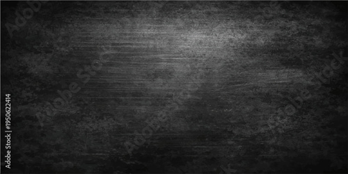 A captivating dark chalkboard texture background, offering an enigmatic backdrop for various creative applications.