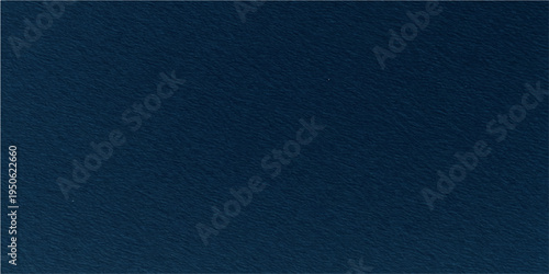 A textured canvas of deep indigo evokes a sense of depth, mystery, and artistic inspiration. 