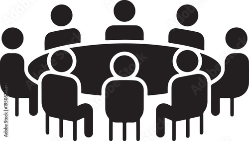 Group of people seated around a round table in a meeting setting