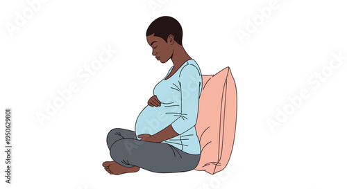 Young pregnant woman with short dark hair sitting cross legged with a pillow cradling her belly with a calm serene