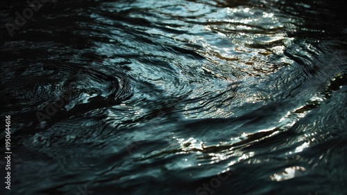 Dark Water Surface with Ripples and Shimmering Light