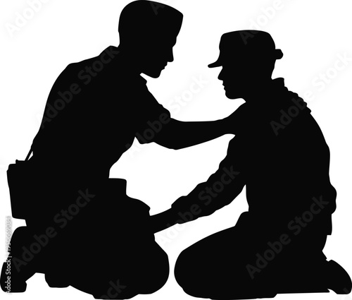 Two military personnel kneeling in a supportive and collaborative pose