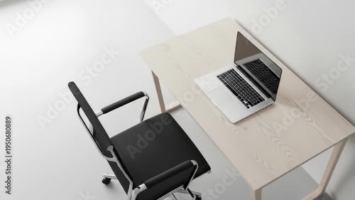 A sleek, modern workspace with a light-colored wooden desk, black office chair, and a silver laptop on the desk