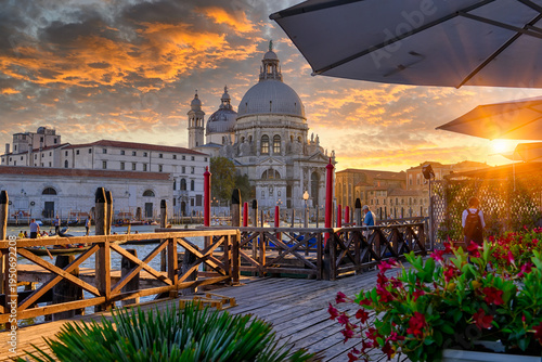 Canal Grande with Venice gondola and Basilica di Santa Maria della Salute in Venice, Italy. Architecture and landmarks of Venice. Venice postcard