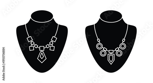 Two necklaces displayed on busts a striking black silhouette