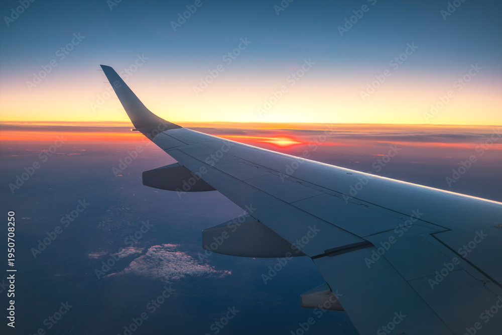 Fototapeta premium Aerial view from the plane over fluffy clouds